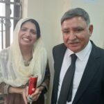 Tariq Aziz Bhatti with a supporter in Rawalpindi, PTI campaign event