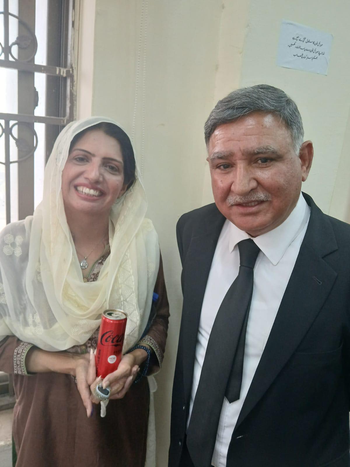 Tariq Aziz Bhatti with a supporter in Rawalpindi, PTI campaign event
